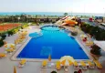 Buy Apartments in a European complex on the first line from the sea in Tosmur 4