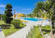 Buy Apartments in a European complex on the first line from the sea in Tosmur 9