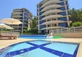 Buy Luxurious duplex apartment with garden access and sea views in Kargicak 1 