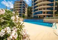 Buy Luxurious duplex apartment with garden access and sea views in Kargicak 2 