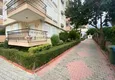 Buy Apartment 1 + 1 with furniture and mountain views in a complex with infrastructure, the center of Alanya 14 