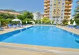Buy Apartment 1 + 1 with furniture and mountain views in a complex with infrastructure, the center of Alanya 6 