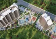 Buy Apartments at affordable prices in a residential complex under construction Cesmeli-Mersin 2
