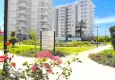 Buy 3+1 linear apartment with furniture, sea and mountain views on the beachfront - Tosmur, Alanya 7