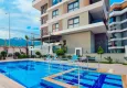 Buy 1+1 apartment in Alanya, Oba district with furniture and mountain views — installments up to 6 months 1