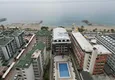 Buy 1+1 apartment with sea view in a complex on the beachfront in the Oba area 1 