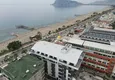 Buy 1+1 apartment with sea view in a complex on the beachfront in the Oba area 3 
