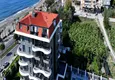 Buy 1+1 apartment overlooking the sea and the fortress on the beachfront in Kestel 4