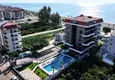 Buy 1+1 apartment overlooking the sea and the fortress on the beachfront in Kestel 6
