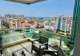 Buy 1+1 apartment in Tosmur, 76 m2 with furniture and sea view - property for a residence permit in Alanya  1 