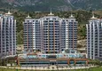 Buy 3+1 apartment in Alanya, Mahmutlar district — linear with furniture and panoramic views of the sea and mountains 1