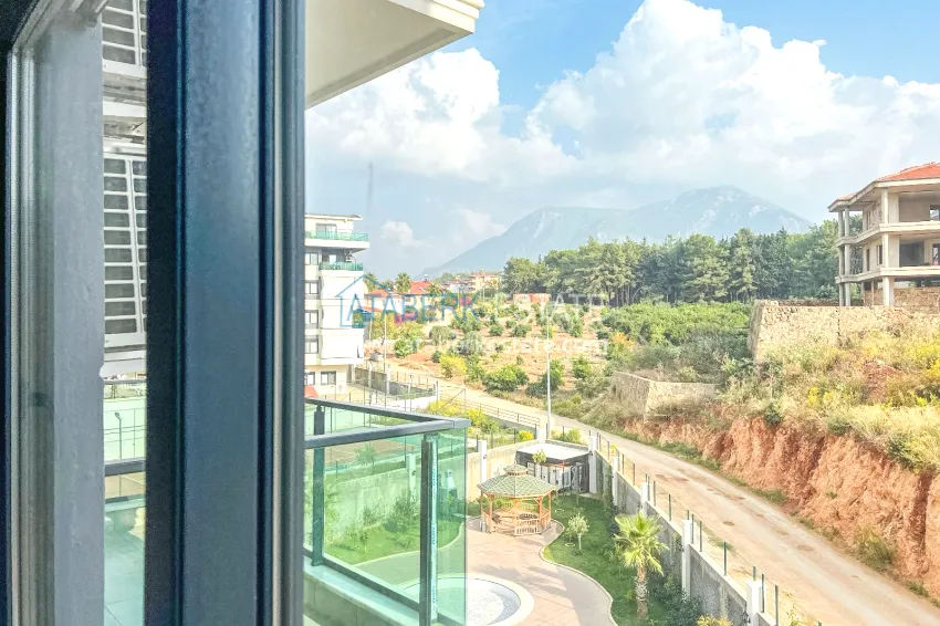 Purchase 1+1 apartment with furniture and mountain views in a new complex, Oba district — Alanya 13