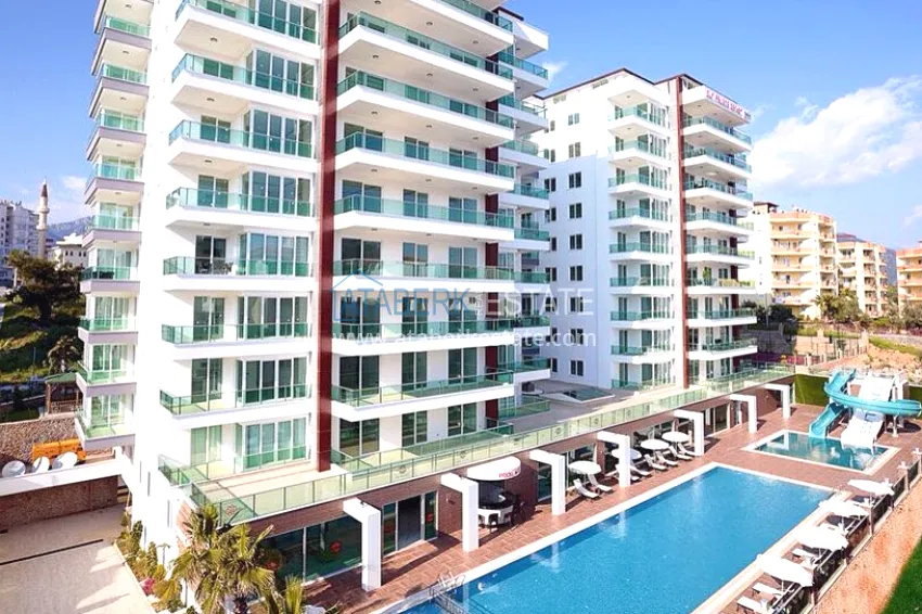 Real estate for a residence permit. Three-room apartment with furniture in Alanya, Tosmur district 1