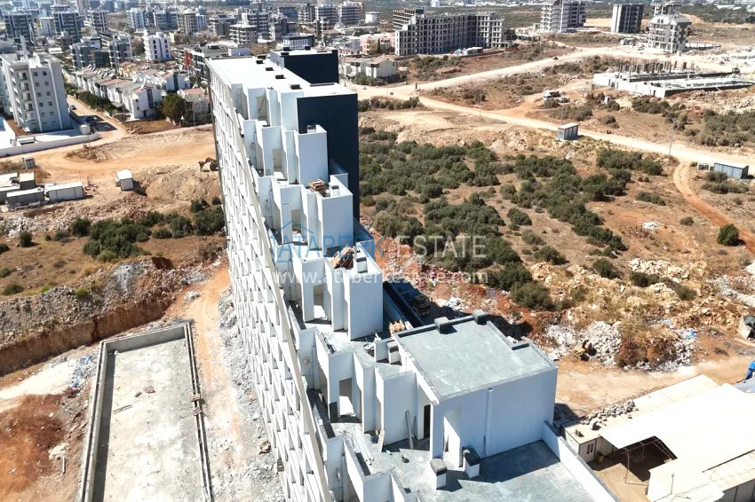 Investor offer — a one-bedroom apartment in a complex under construction, Altintash district, Antalya 13