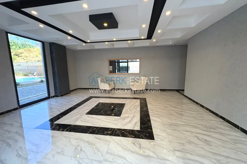 New 1+1 apartment in Mahmutlar, Alanya — new building with mountain views 12