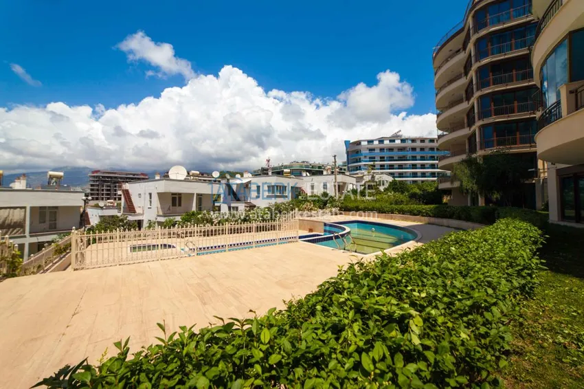 Luxurious duplex apartment with garden access and sea views in Kargicak 10 