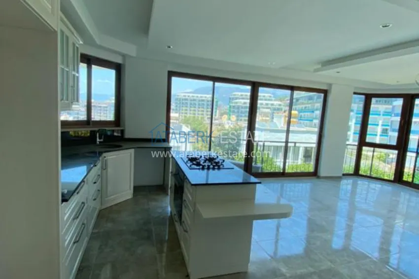 Purchase  Luxurious duplex apartment with garden access and sea views in Kargicak 1 