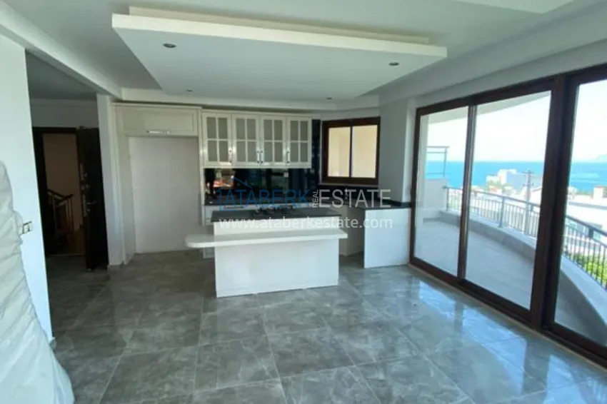 Purchase  Luxurious duplex apartment with garden access and sea views in Kargicak 2 