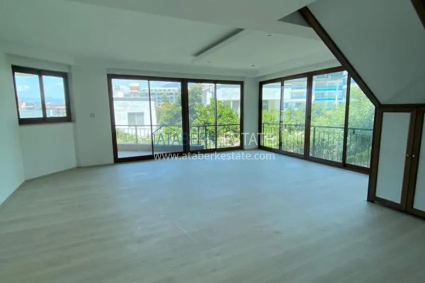 Purchase  Luxurious duplex apartment with garden access and sea views in Kargicak 3 