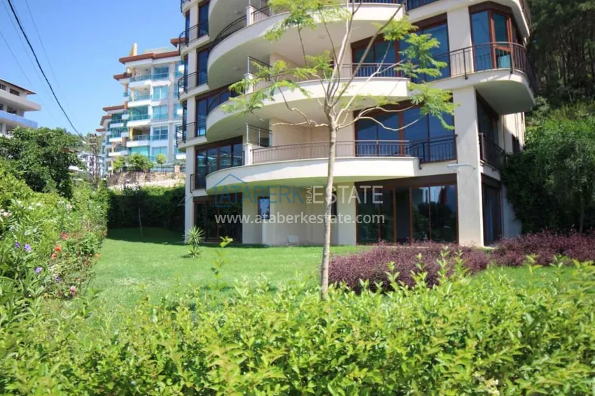 Luxurious duplex apartment with garden access and sea views in Kargicak 4 