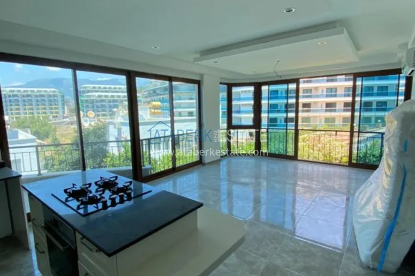 Purchase  Luxurious duplex apartment with garden access and sea views in Kargicak 4 