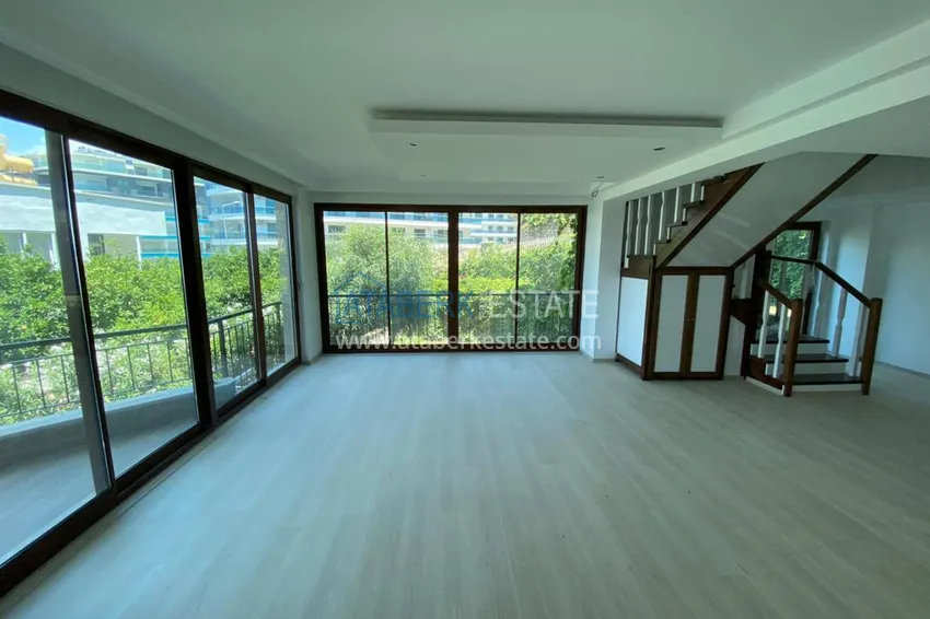 Purchase  Luxurious duplex apartment with garden access and sea views in Kargicak 5 