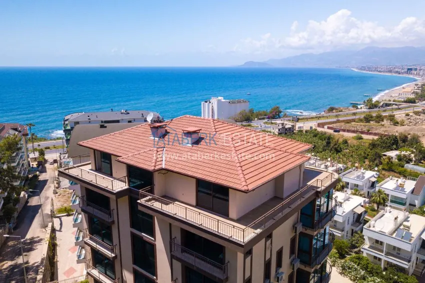 Luxurious duplex apartment with garden access and sea views in Kargicak 7 