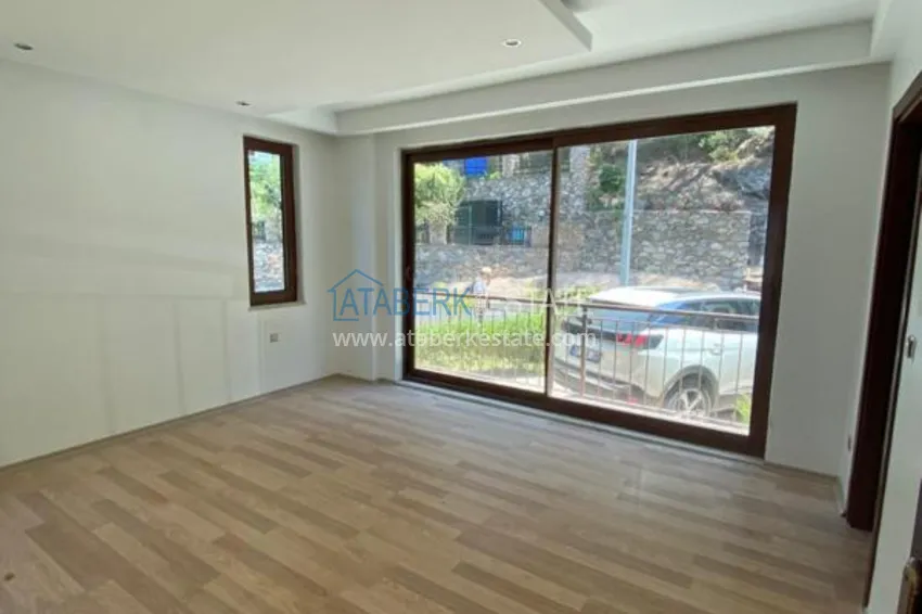 Purchase  Luxurious duplex apartment with garden access and sea views in Kargicak 7 