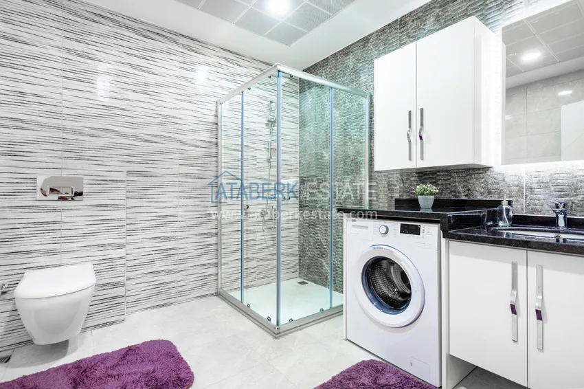 Purchase  Penthouse in Mahmutlar — elegant interior, separate kitchen, side sea view  16 