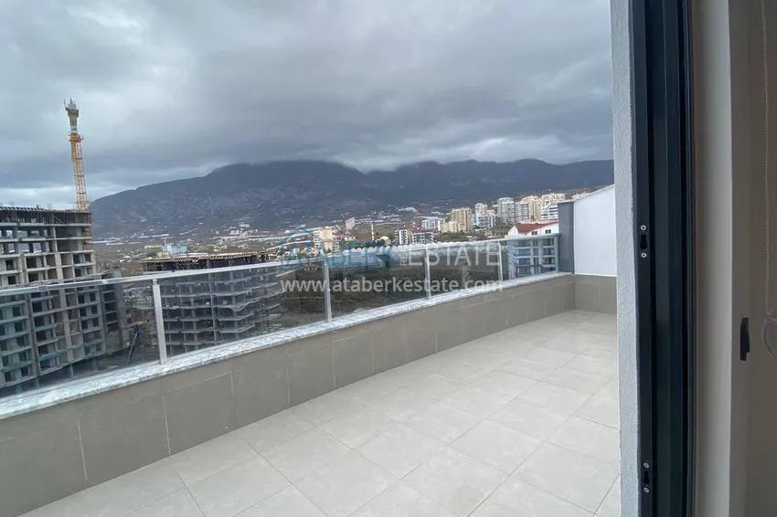 Purchase Furnished duplex penthouse in Mahmutlar with views of the mountains, the sea and the historic fortress 14 