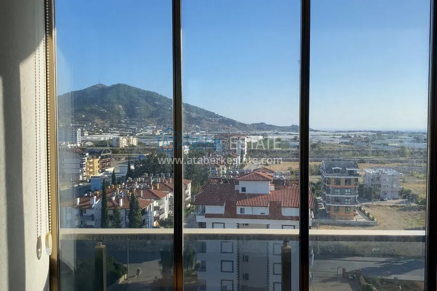 Purchase  Furnished one-bedroom apartment with a glazed balcony and a panoramic open view of the sea and mountains - Gazipasa 9 