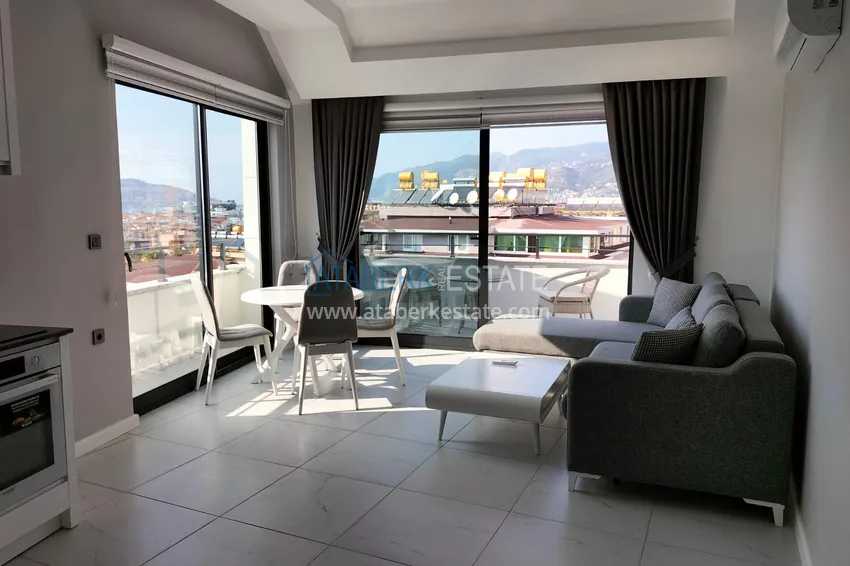 Purchase  1+1 penthouse with sea and mountain views in Alanya Tosmur B21 district 1 