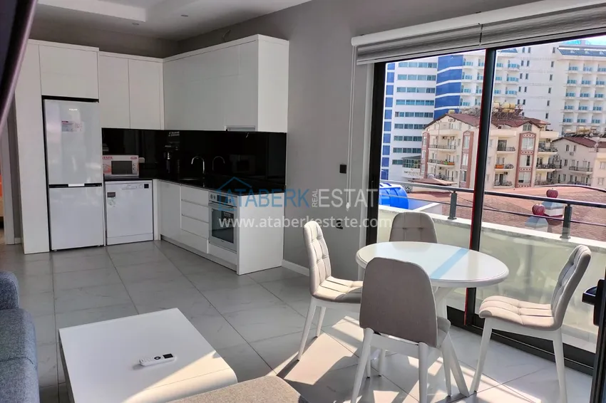 Purchase  1+1 penthouse with sea and mountain views in Alanya Tosmur B21 district 6 