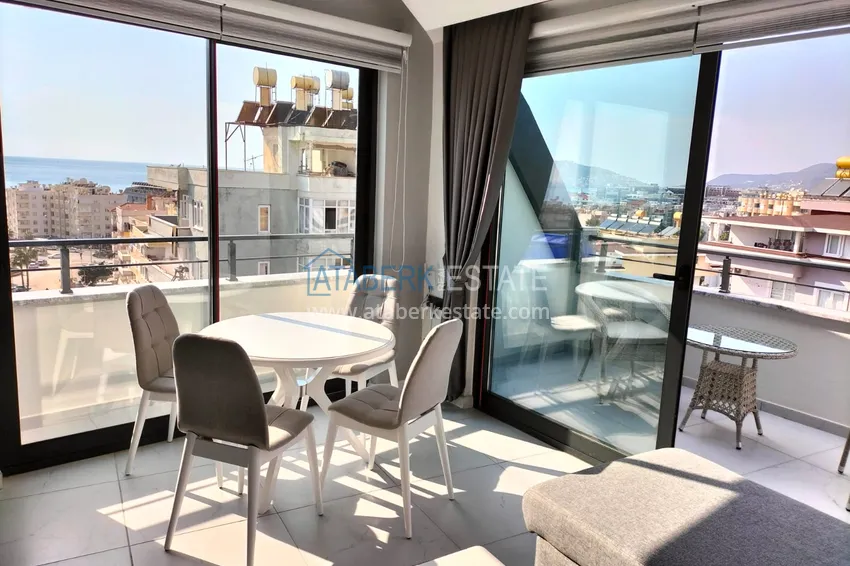 Purchase  1+1 penthouse with sea and mountain views in Alanya Tosmur B21 district 8 