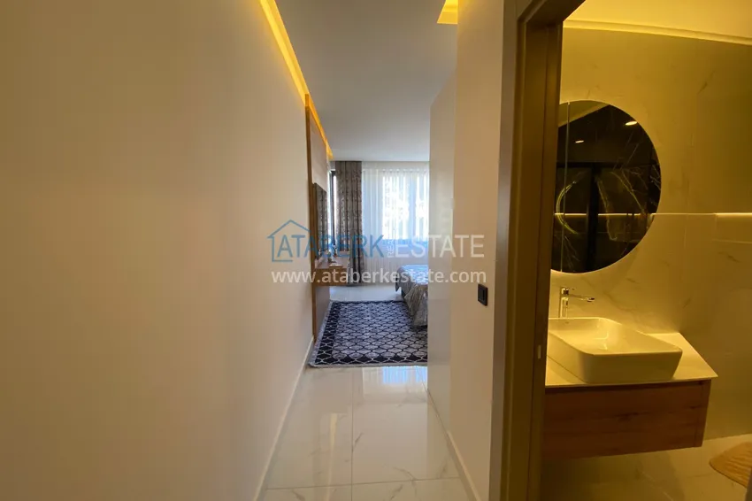 Purchase  Three-room apartment in the center of Alanya with an author's interior and an open view of the mountains 18 