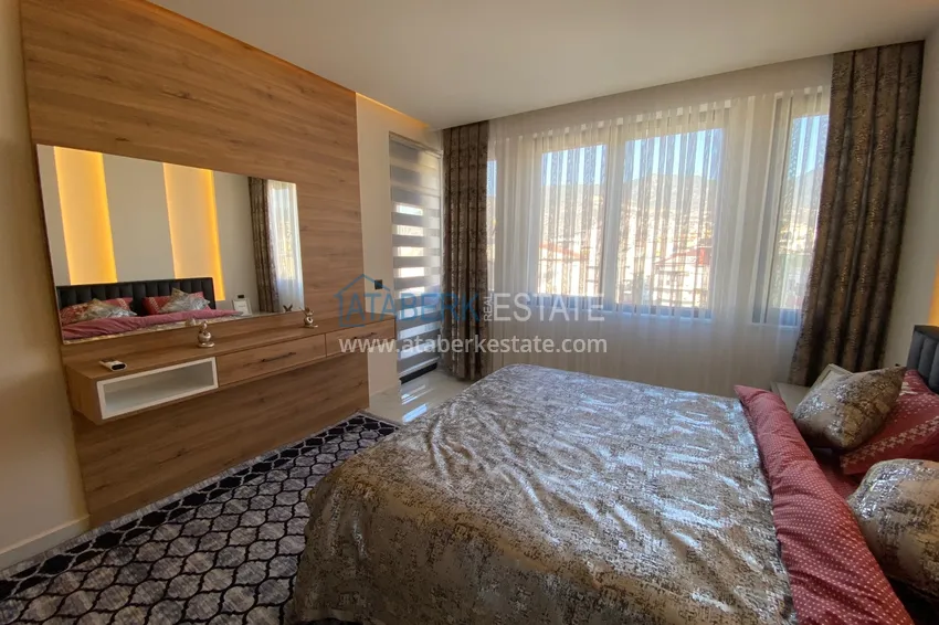 Purchase  Three-room apartment in the center of Alanya with an author's interior and an open view of the mountains 24 