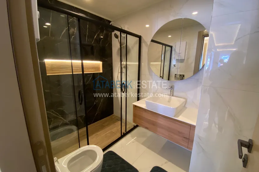 Purchase  Three-room apartment in the center of Alanya with an author's interior and an open view of the mountains 28 