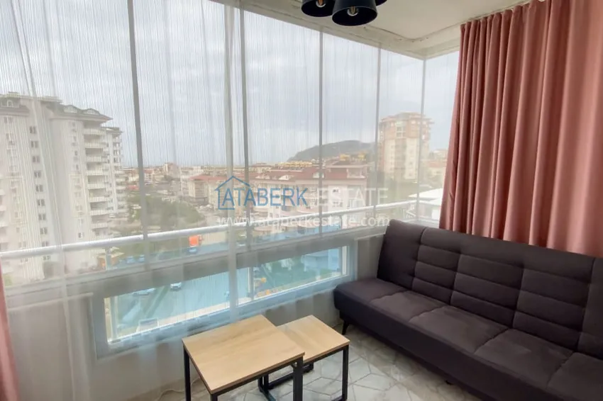 Purchase  Furnished 1 + 1 apartment with a glazed balcony overlooking the sea, mountains and Kale in Cikcilli, Alanya 10 