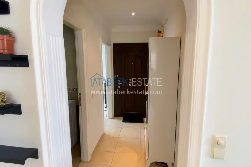 Purchase  Furnished 1 + 1 apartment with a glazed balcony overlooking the sea, mountains and Kale in Cikcilli, Alanya 1 