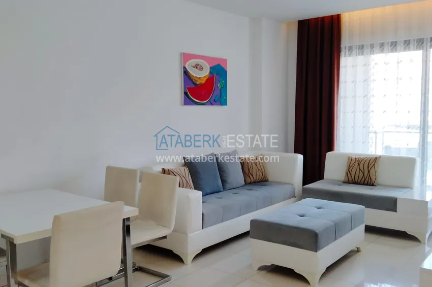 Purchase  1+1 furnished apartment in a complex on the first coastline, Oba-Alanya area. Real estate for residence permit 1 