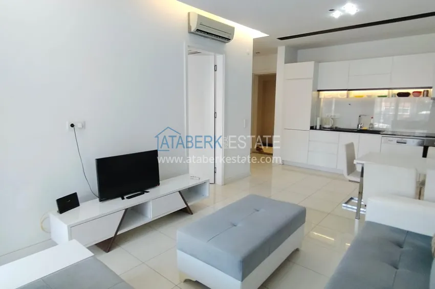 Purchase  1+1 furnished apartment in a complex on the first coastline, Oba-Alanya area. Real estate for residence permit 2 