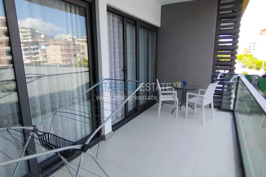 Purchase  1+1 furnished apartment in a complex on the first coastline, Oba-Alanya area. Real estate for residence permit 7 