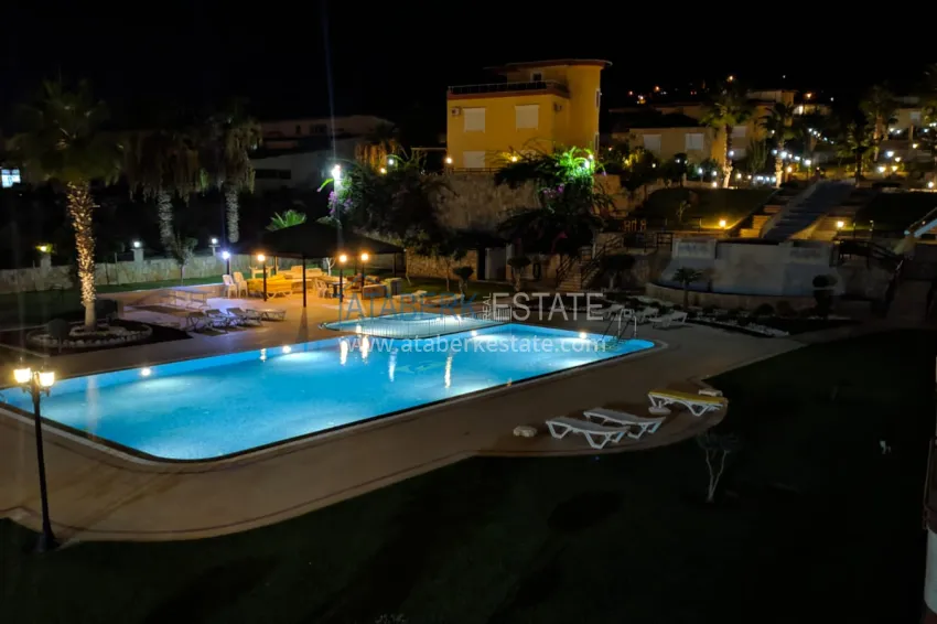 Panoramic two-bedroom apartment with furniture, glazed balcony in Mahmutlar 10