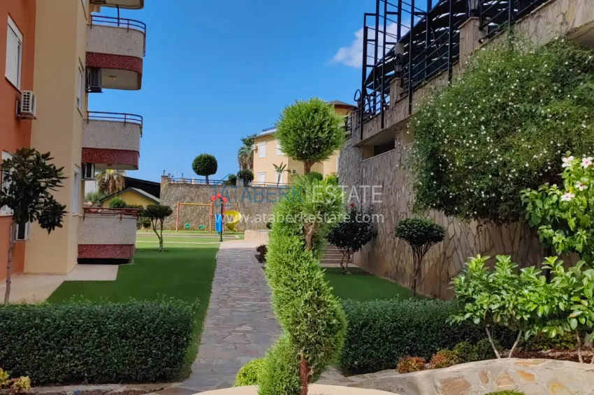 Panoramic two-bedroom apartment with furniture, glazed balcony in Mahmutlar 11