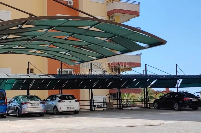 Panoramic two-bedroom apartment with furniture, glazed balcony in Mahmutlar 17