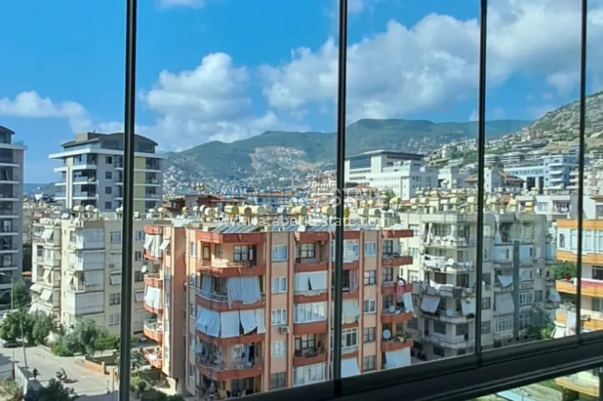 Purchase  3+1 furnished apartment with a glazed balcony and mountain views - Alanya Center 18 