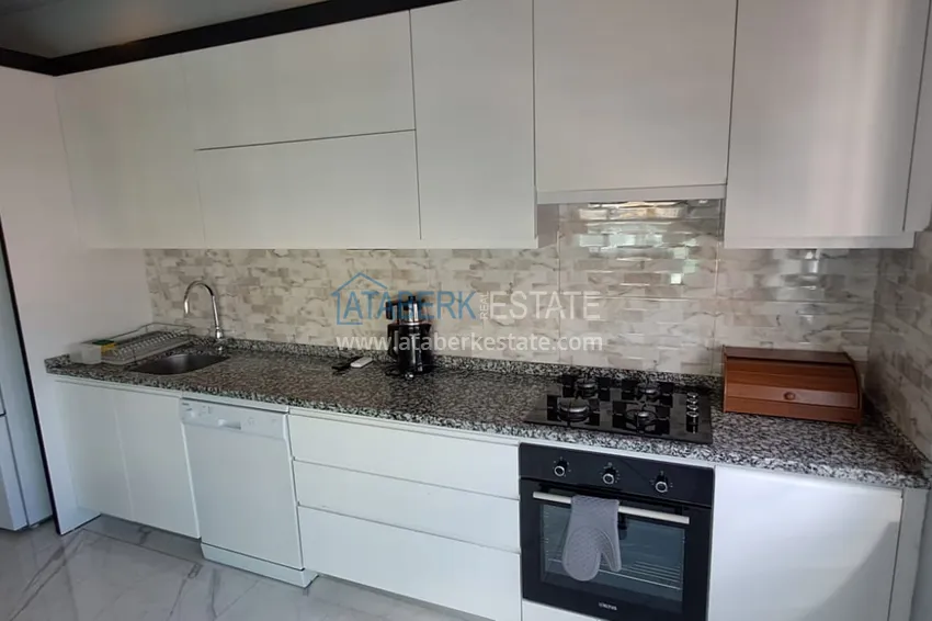 Purchase  3+1 furnished apartment with a glazed balcony and mountain views - Alanya Center 7 