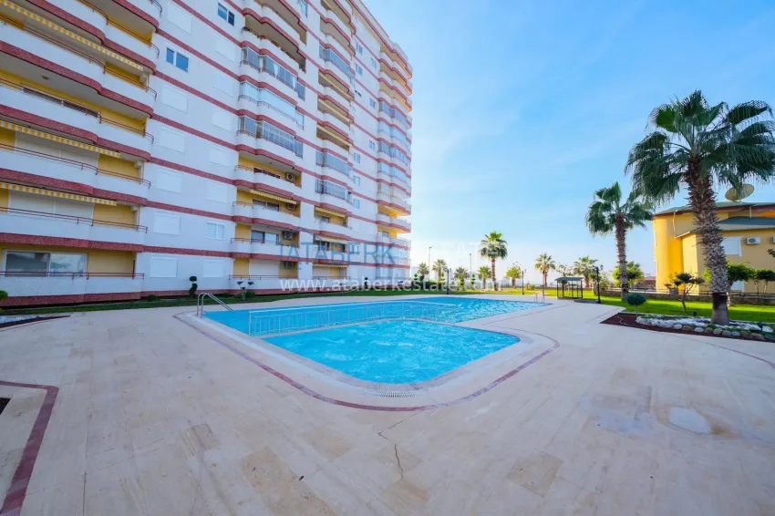 Panoramic two-bedroom apartment with furniture, glazed balcony in Mahmutlar 9