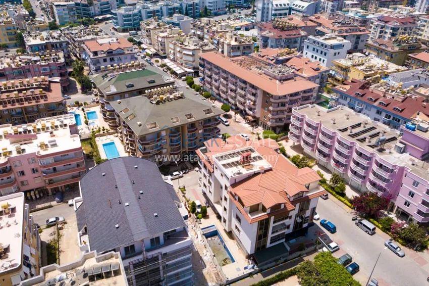 One bedroom apartment with furniture and a glazed balcony in Oba, Alanya 2 