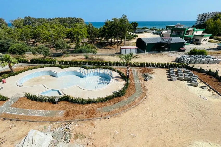 Photo - Apartments 4+1 with sea view in a new residential complex in Davultepe-Mersin area 1